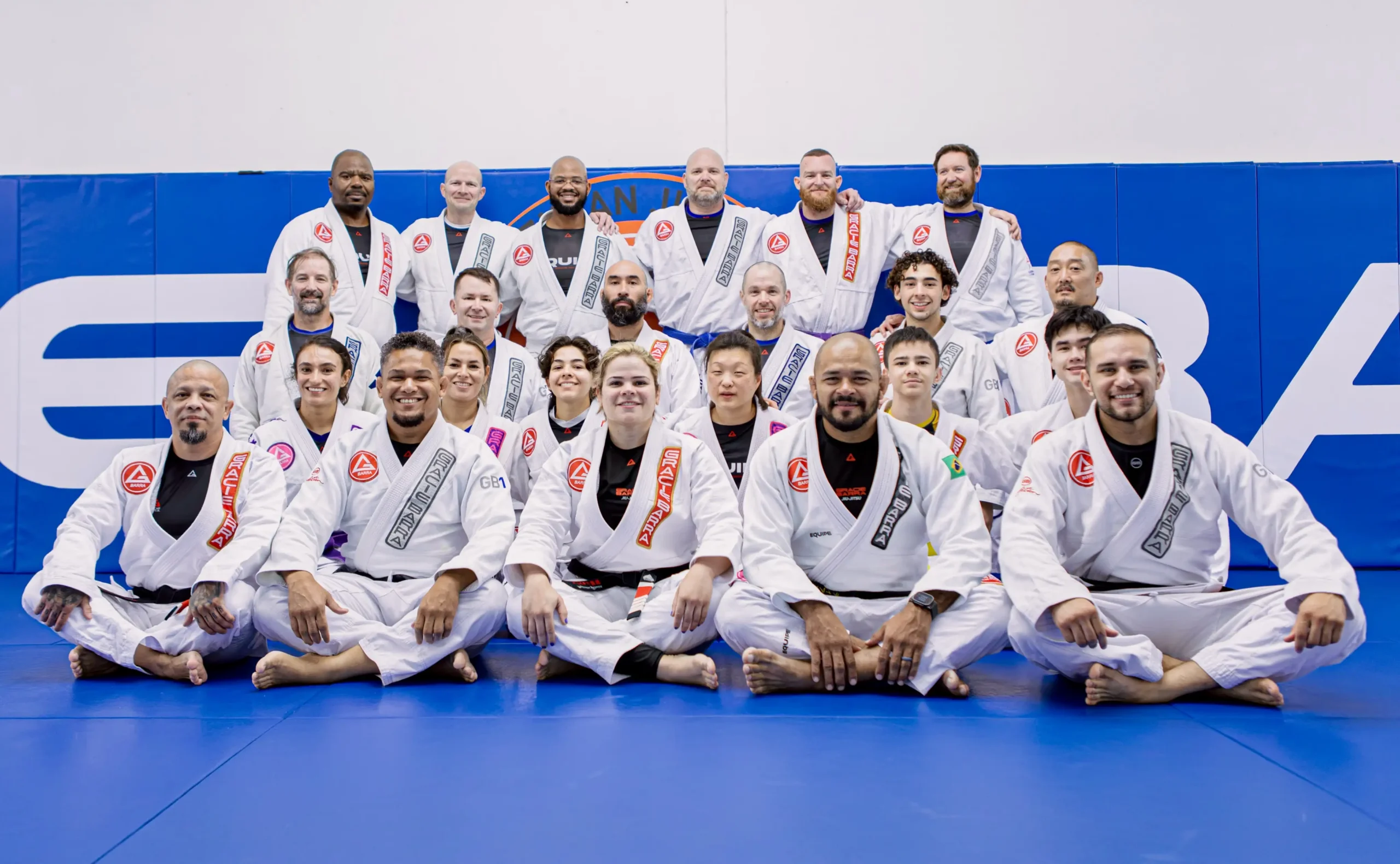 Brazilian Jiu-Jitsu practitioners practicing a grappling technique
